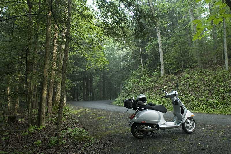 Vespa GTS scooter on a quiet road