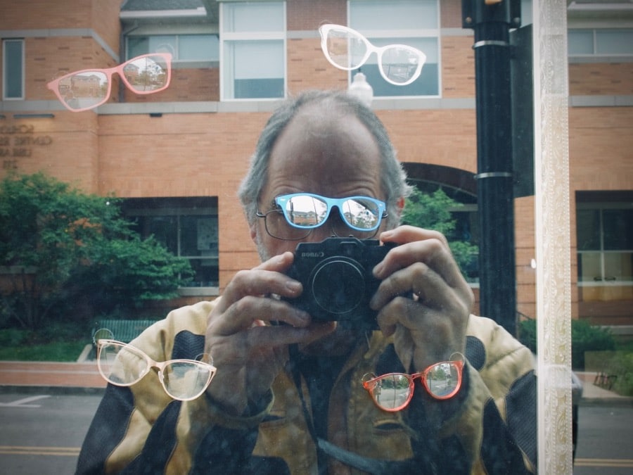 Steve Williams reflected in window