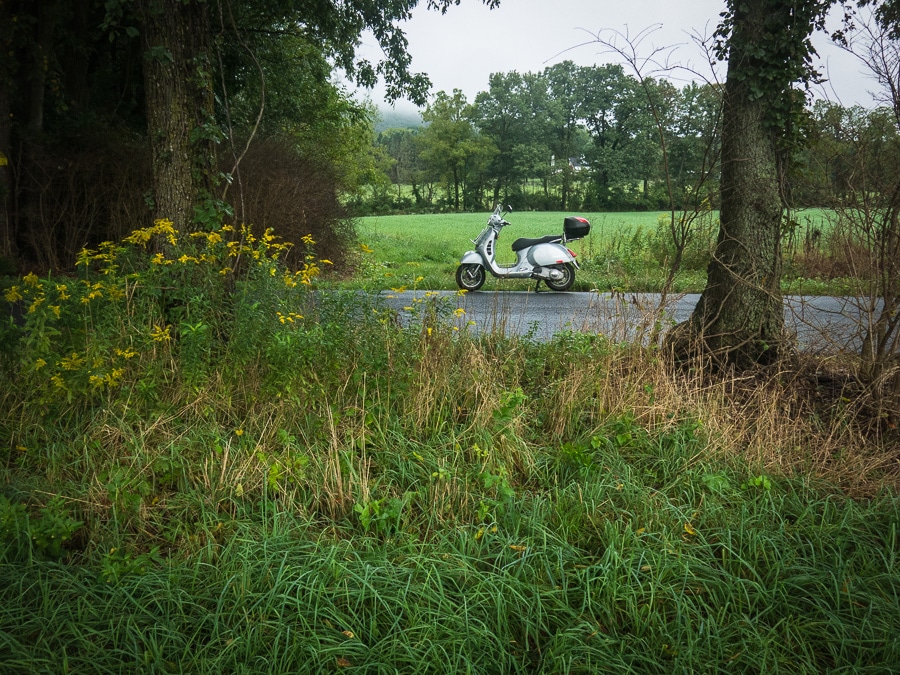 Vespa GTS scooter along rural road