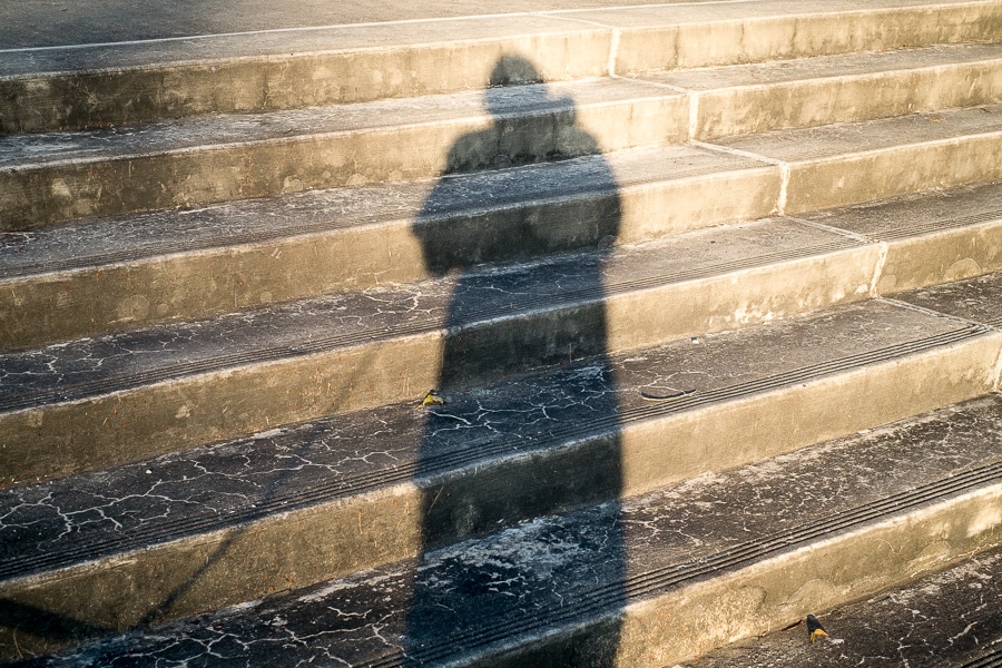 Shadow of photographer on concrete steps