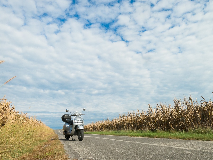 Vespa GTS scooter along rural road