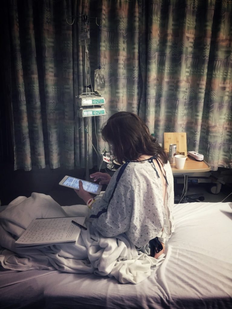 Woman sitting on a hospital bed