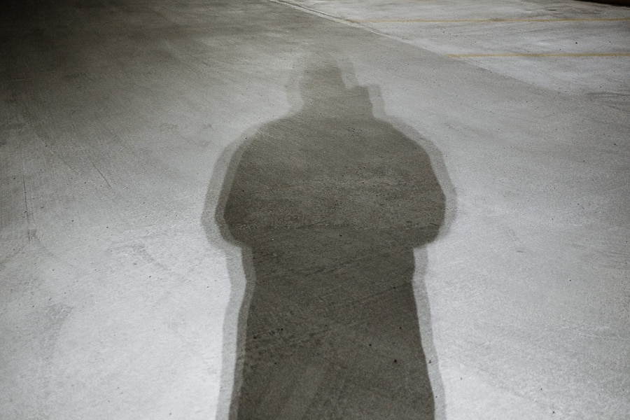 Shadow of a man on concrete floor.