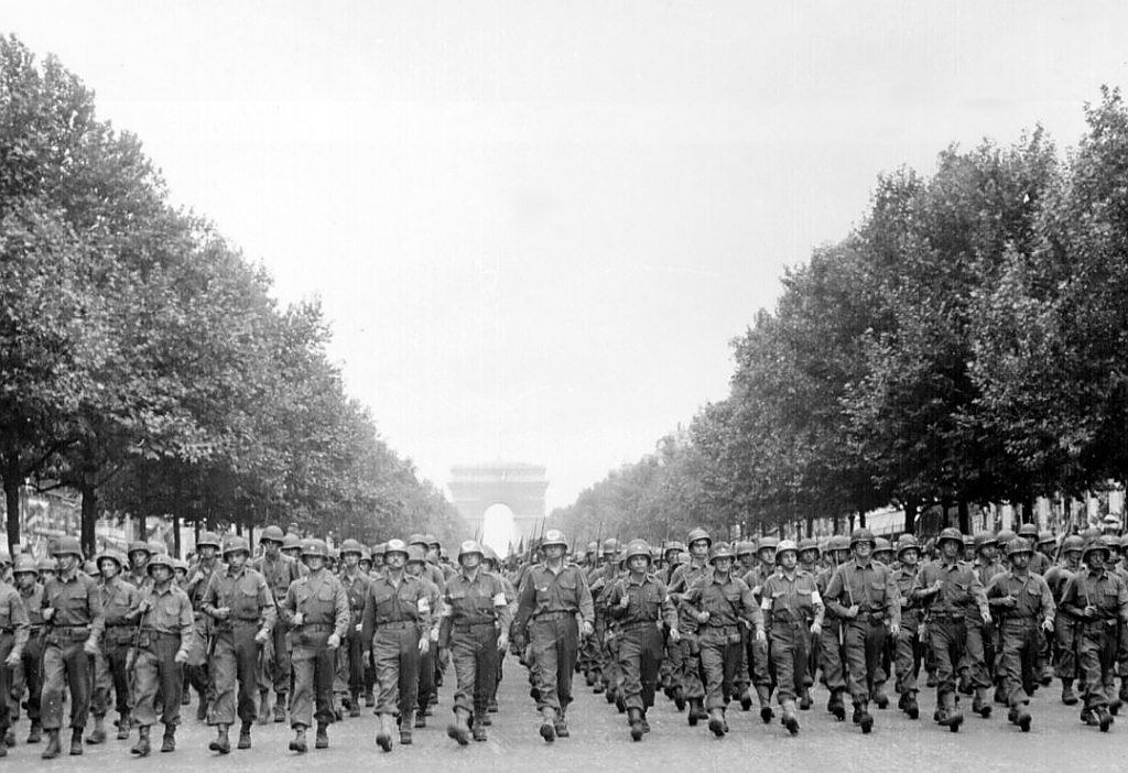 Soldiers marching on the Streets of Paris in 1944.