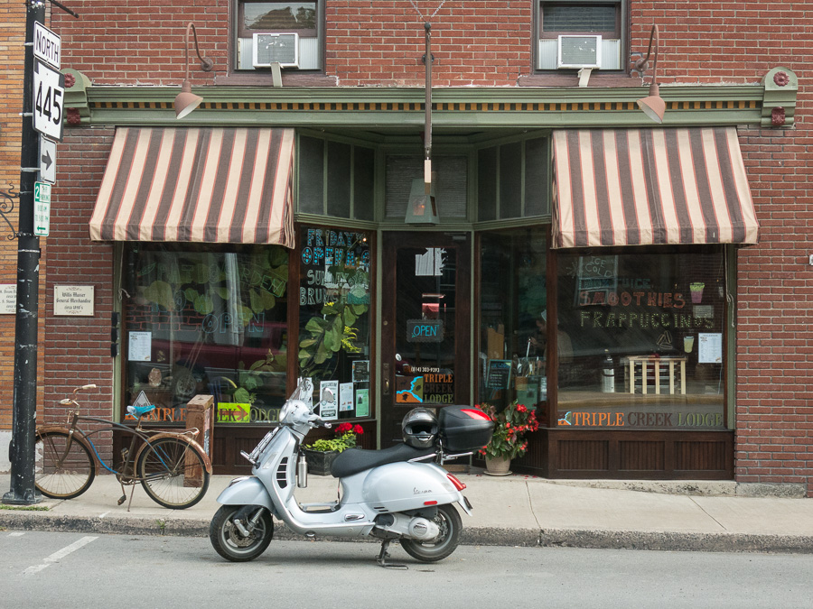 Vespa GTS scooter parked in front of the IngleBean Coffee House