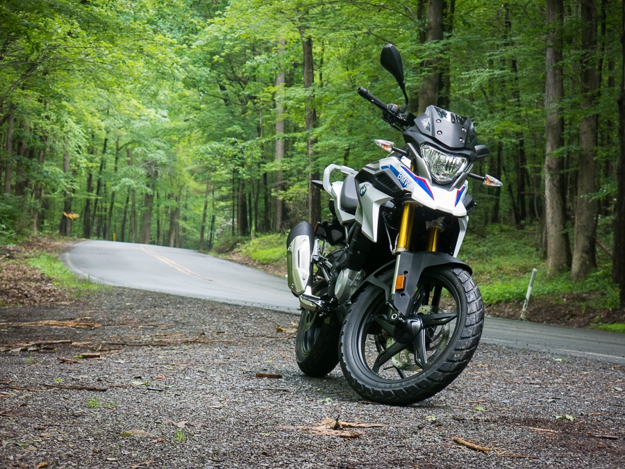 BMW G 310 GS motorcycle along a forest road
