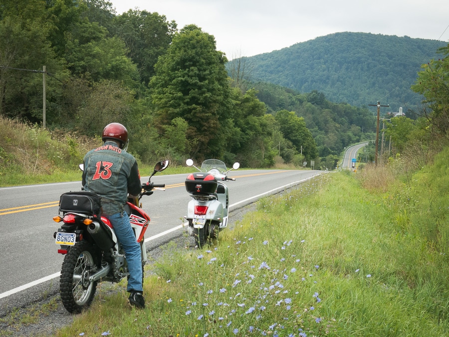 Motorcycle and scooter stopped along a rural Pennsylvania road