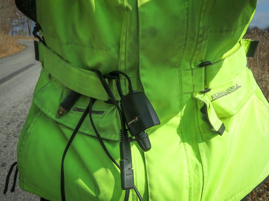 Electric glove controller looped onto a riding jacket