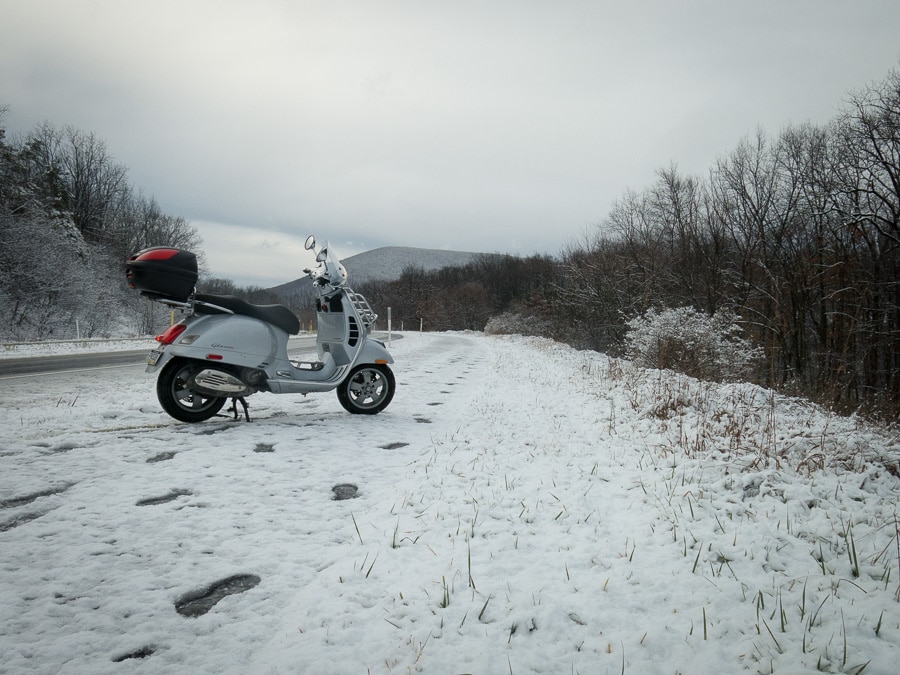 Vespa GTS scooter in the snow.