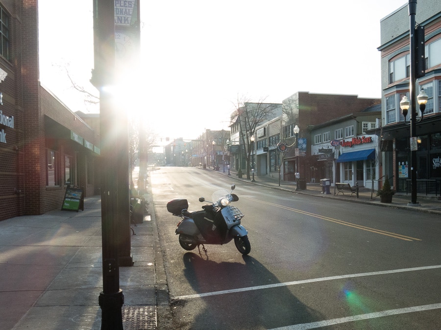 Vespa GTS scooter along street on Christmas morning.