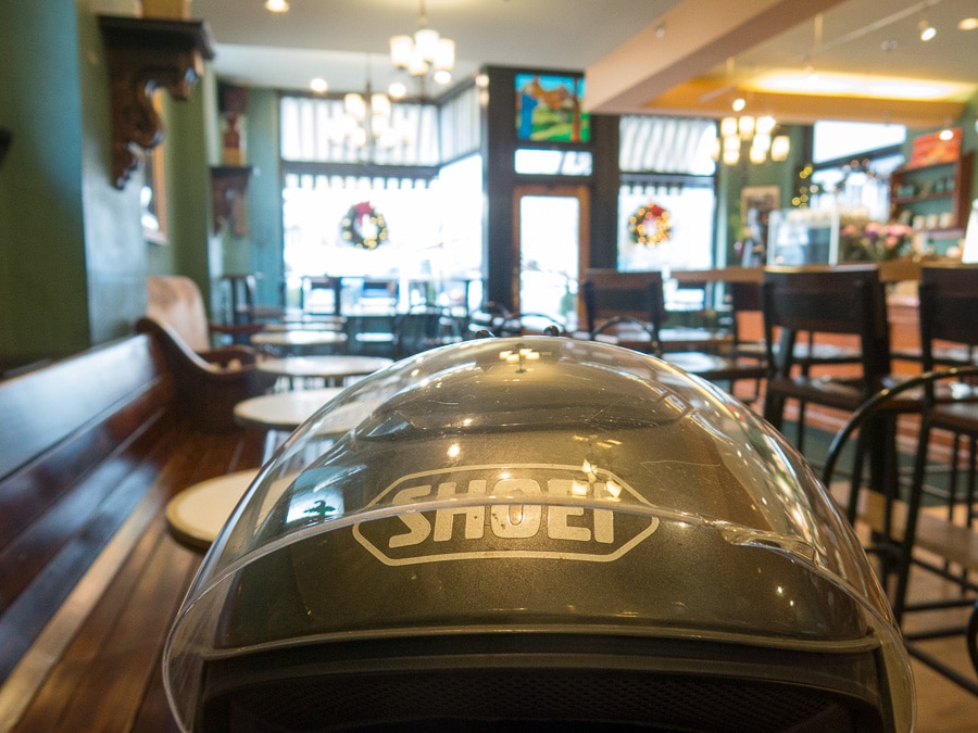 Motorcycle helmet on table in cafe