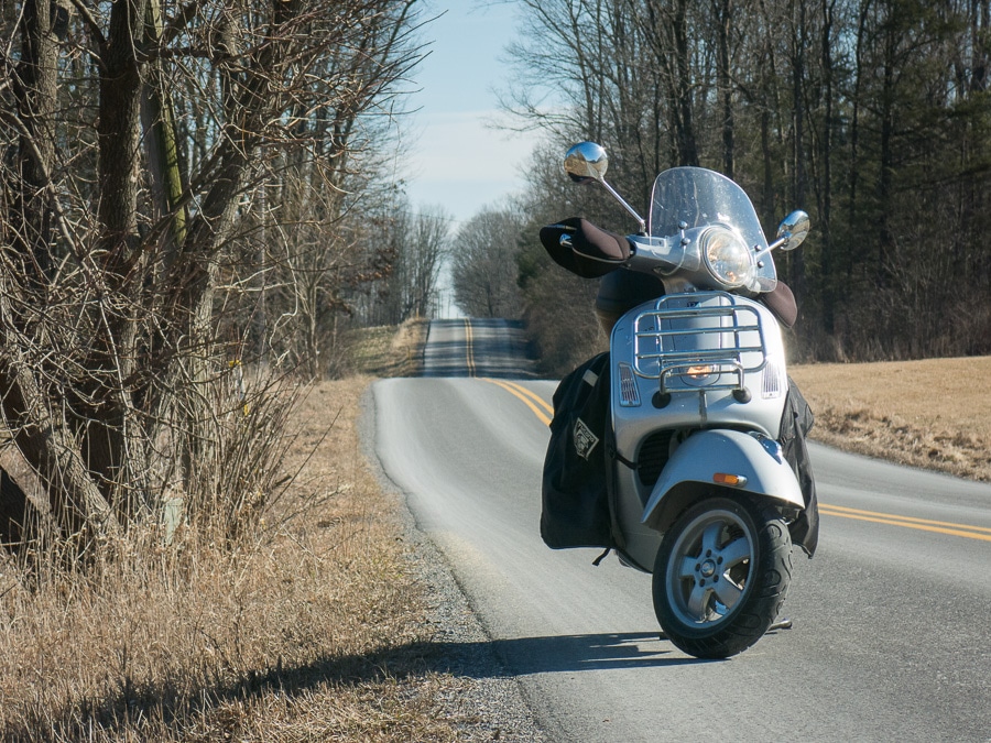 Vespa GTS scooter on a rural road