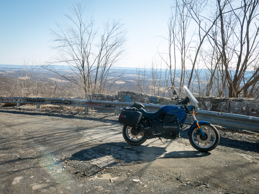 BMW K75 motorcycle parked at a scenic overlook