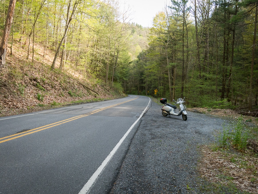 Vespa GTS scooter along a rural road