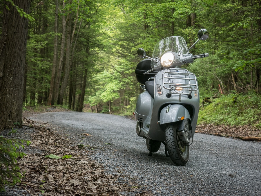 Vespa GTS scooter on a gravel road