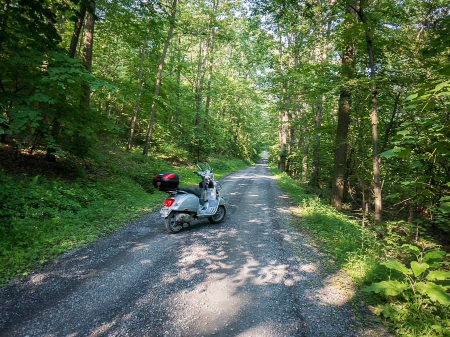 Vespa GTS scooter on the gravel road.