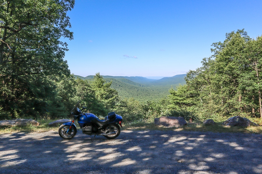 BMW K75C motorcycle parked at a scenic vista