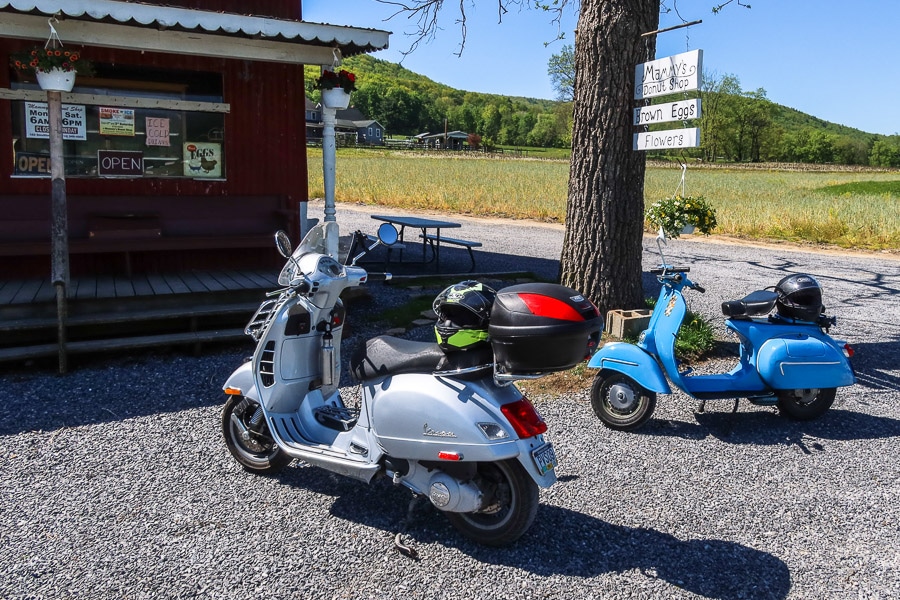 Vespa scooters at a rural Amish donut shop.