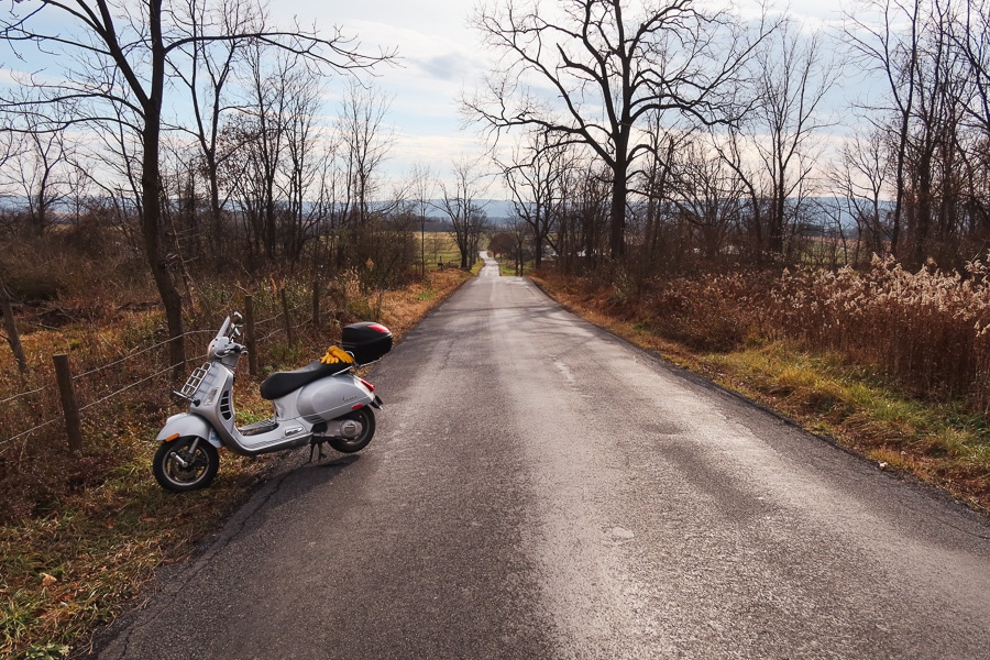 Vespa GTS 250 scooter on a lonely road.