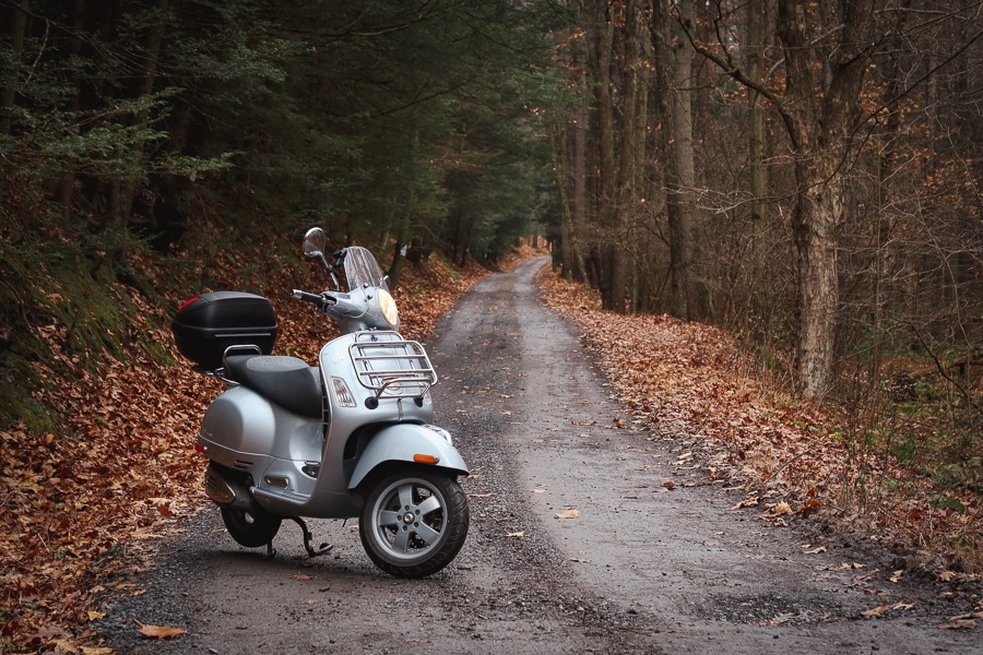 Vespa GTS 250 on a forest road.