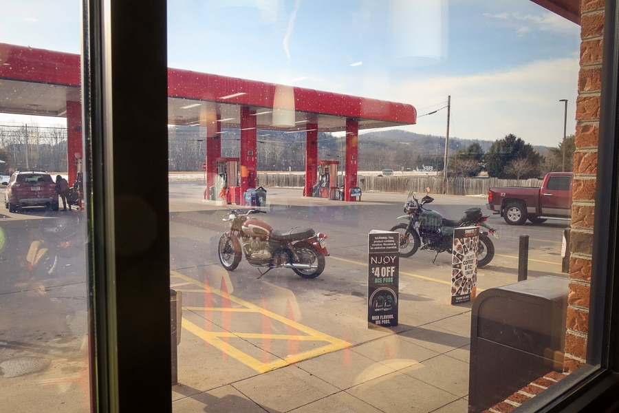 View of two motorcycles through the window of a Sheetz store