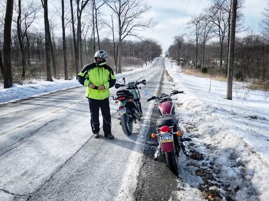 Steve Williams standing with two motorcycles on a winter ride.