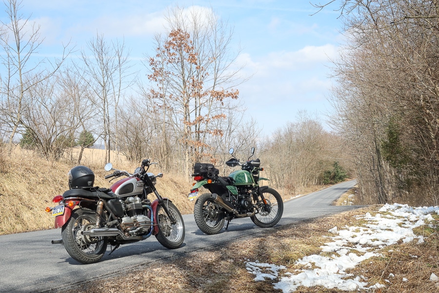 Two motorcycles along a rural road.