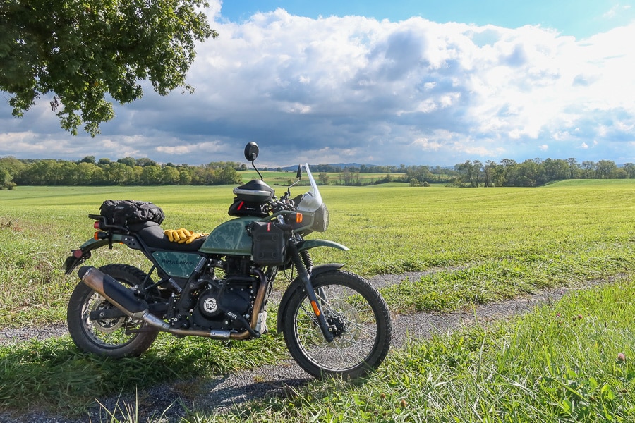 2022 Royal Enfield Himalayan motorcycle in a farm field.