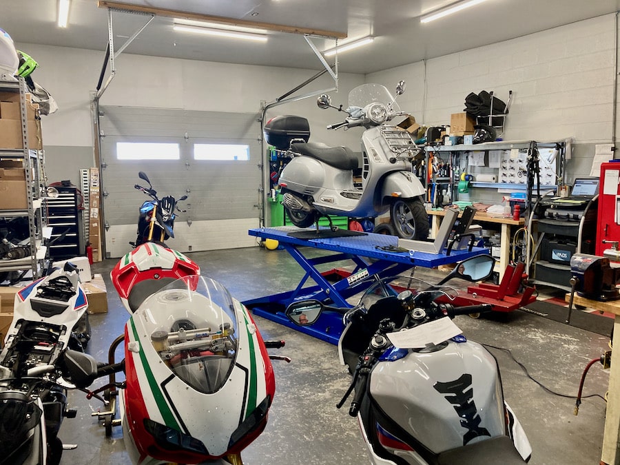 2006 Vespa GTS 250 on lift in shop