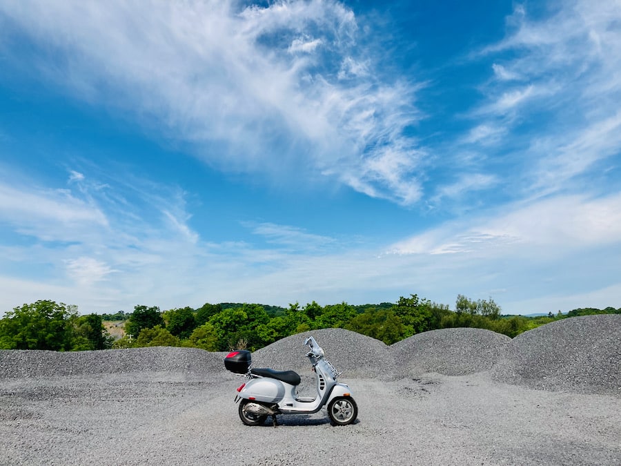 Vespa GTS scooter at a limestone quarry.