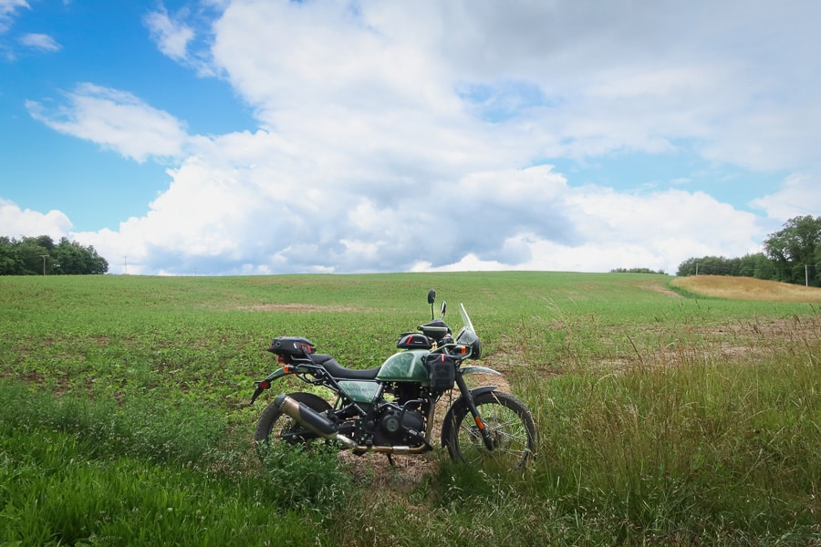 2022 Royal Enfield Himalayan parked in a hayfield.