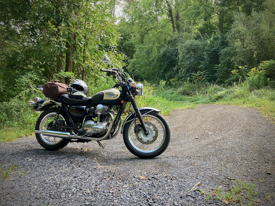 2001 Kawasaki W650 parked on a gravel road.