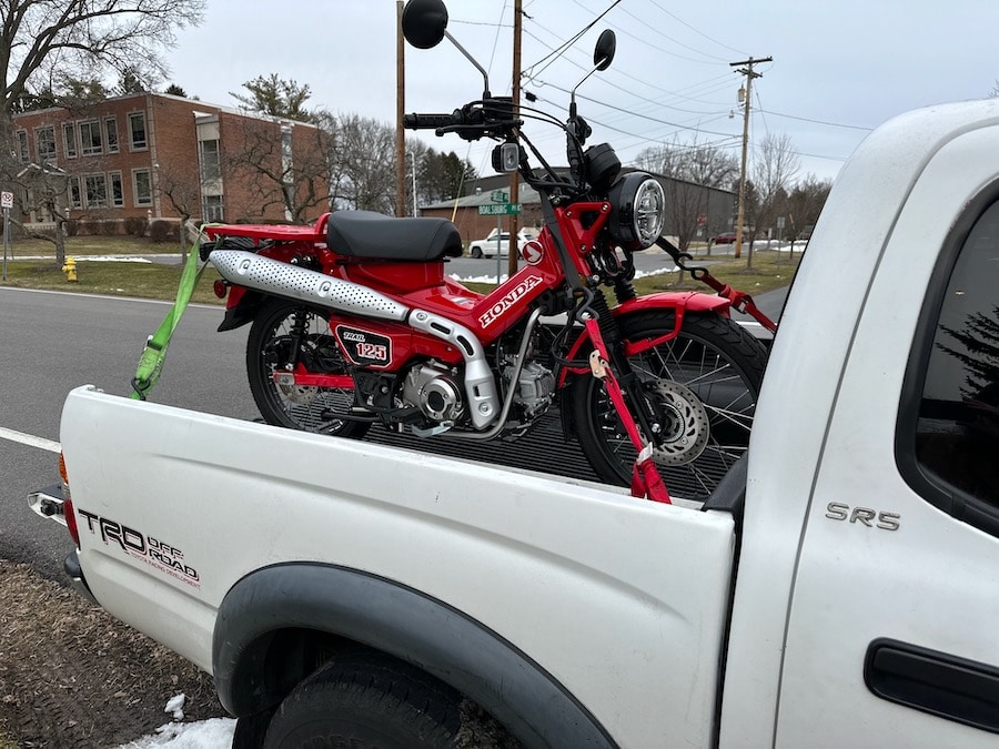 2021 Honda CT125 Trail in the back of a pickup truck.