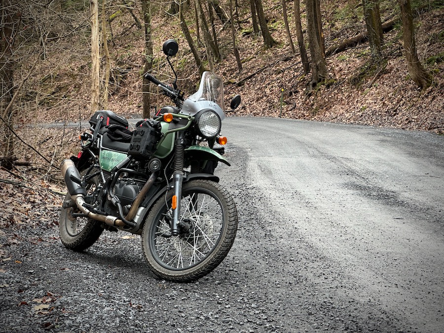 2022 Royal Enfield Himalayan motorcycle on a gravel forest road.