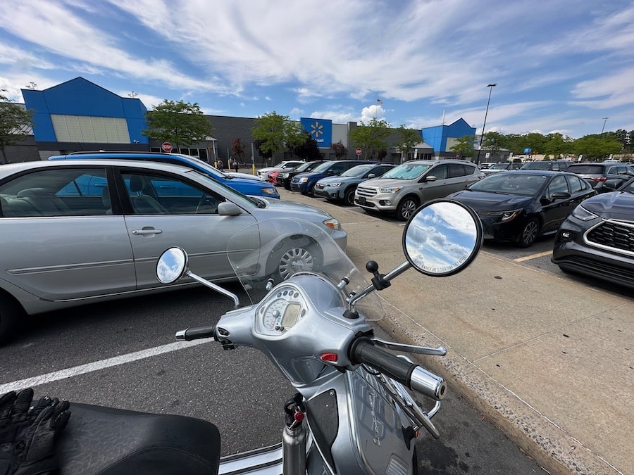 Vespa GTS scooter parked at WalMart.