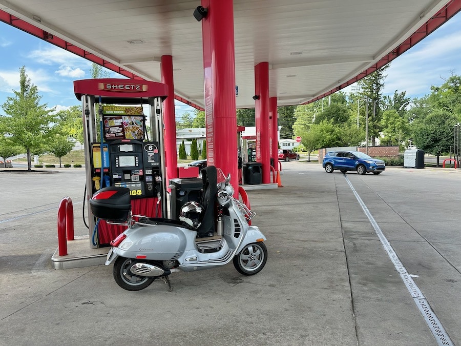 Vespa GTS scooter getting gas at Sheetz.