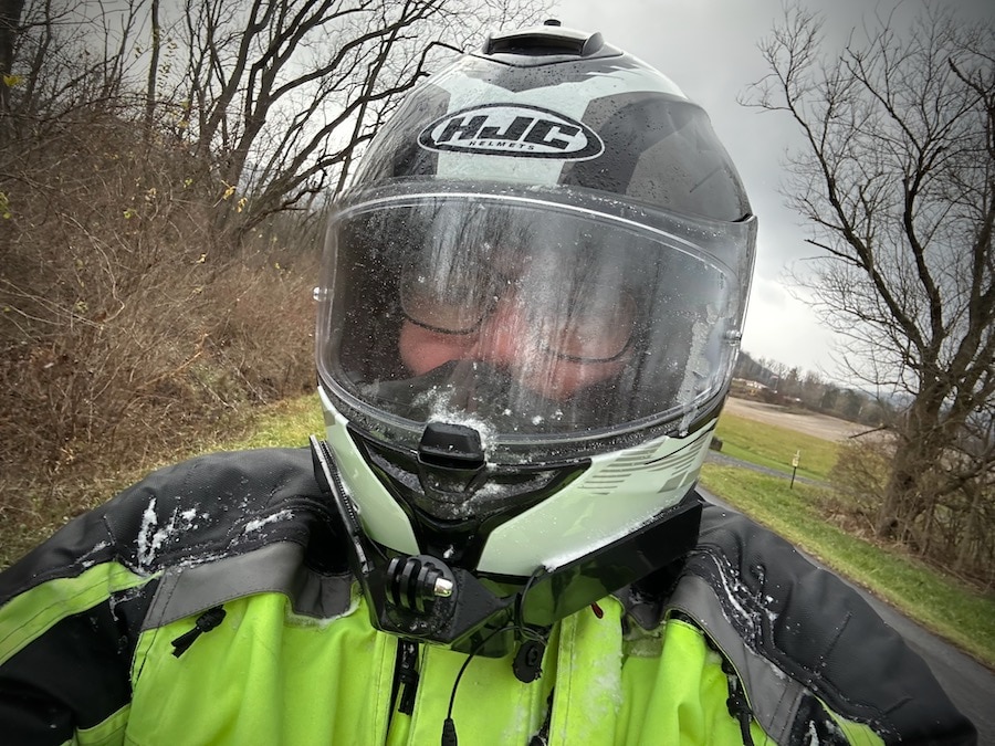 Motorcycle rider portrait with snow.