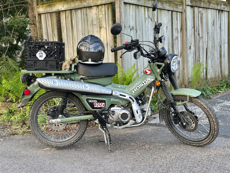 2024 Honda Trail 125 motorcycle parked in a driveway.