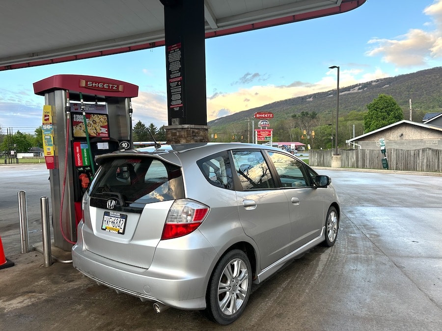2011 Honda Fit getting fuel.
