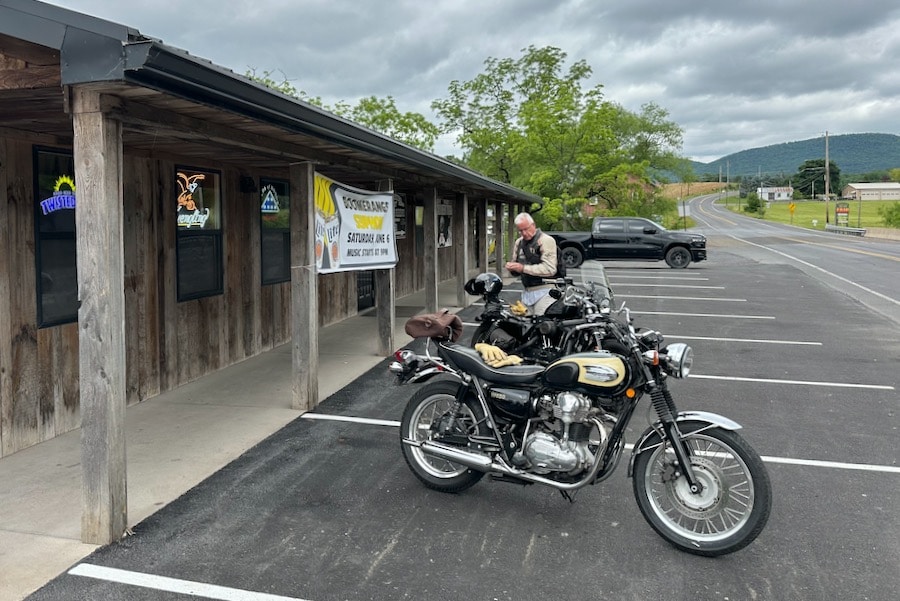 Motorcycles parked outside a tavern.