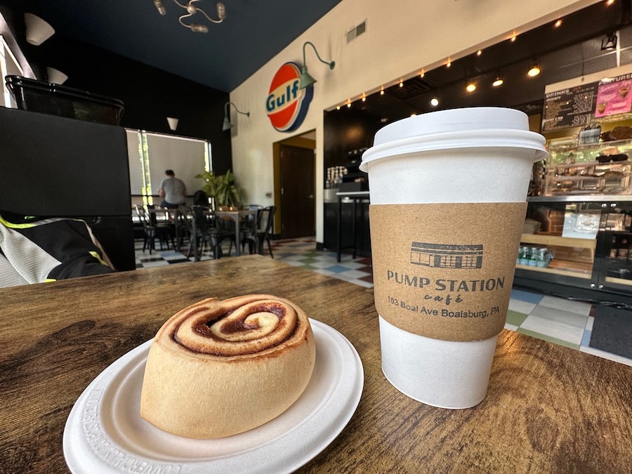 A cinnamon roll and hot tea at the Pump Station Cafe.