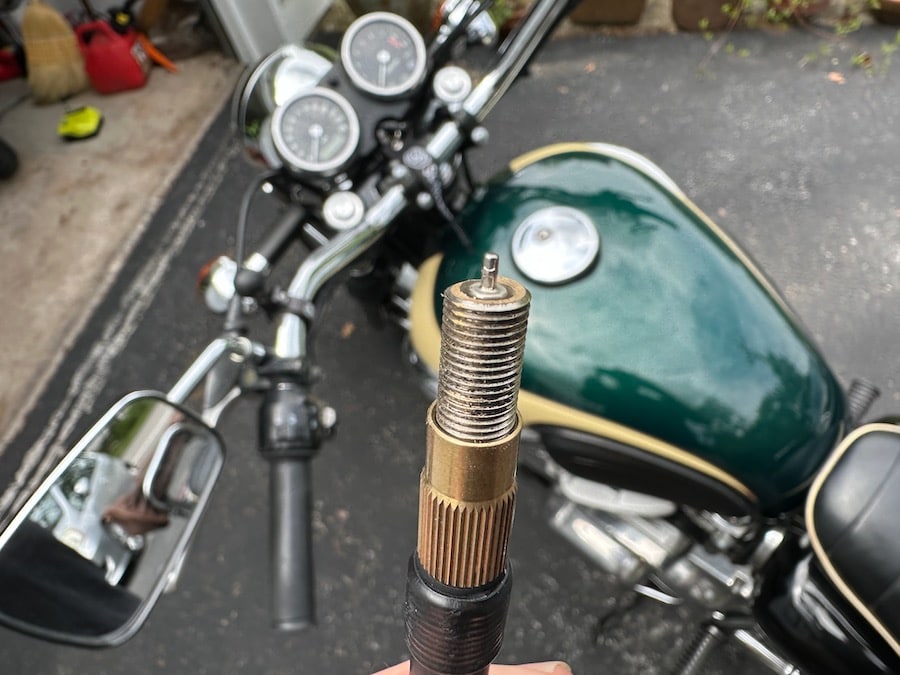 A tire valve broken off in a tire inflator hose.