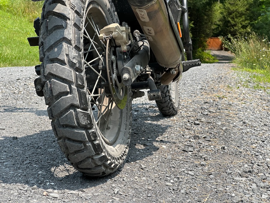A Dunlop Trailmax Mission tire on the back of a 2022 Royal Enfield Himalayan motorcycle.