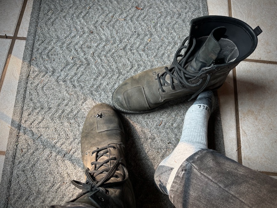 Putting on motorcycle boots.