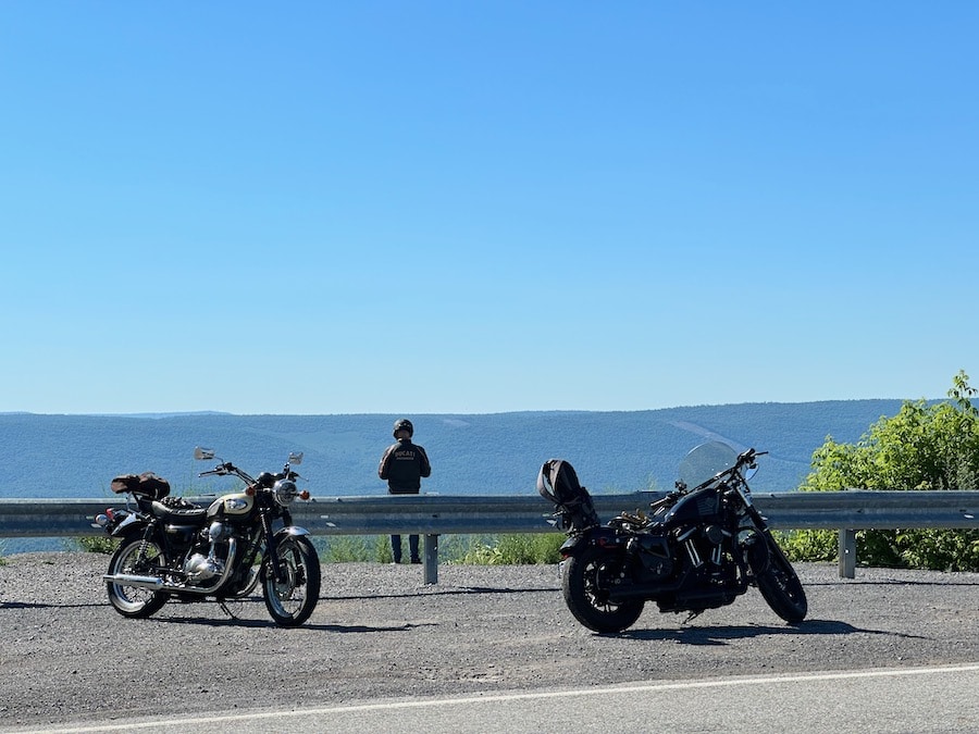 Man and motorcycles atop Jack's Mountain.