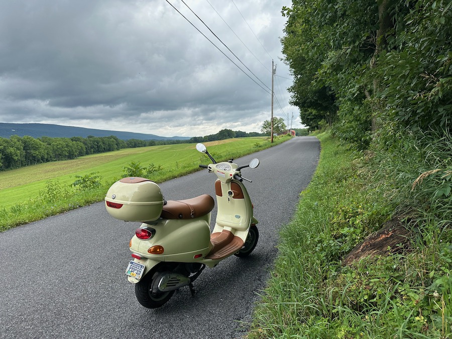 A 2005 Vespa ET4 scooter on a rural road.