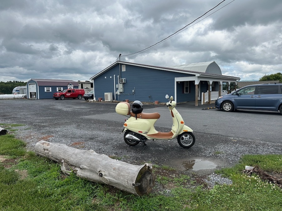 A 2005 Vespa ET4 scooter parked at a diner.