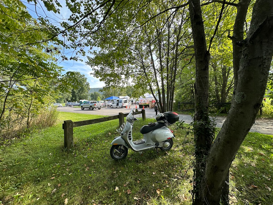 A Vespa GTS scooter parked at the Boalsburg Farmers Market.