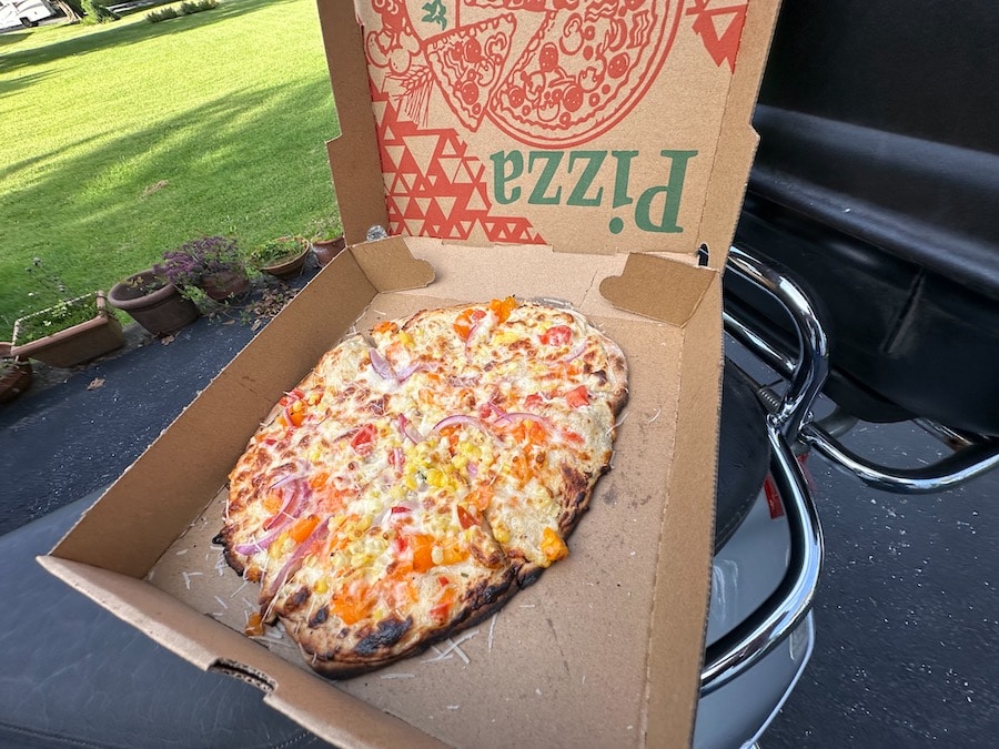 A chef prepared sweet corn pizza from the Boalsburg Farmers Market.