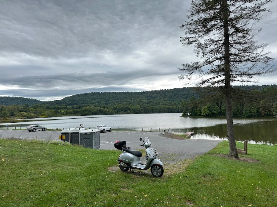 A Vespa GTS scooter parked at Colyer Lake.
